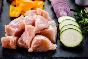 Raw chicken strips with vegetables