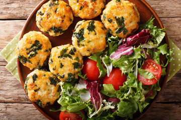 Dietary tasty meat balls with spinach and vegetable salad close-up. Horizontal top view