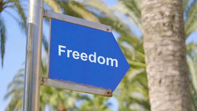 Road to freedom concept sign in 4k slow motion 60fps