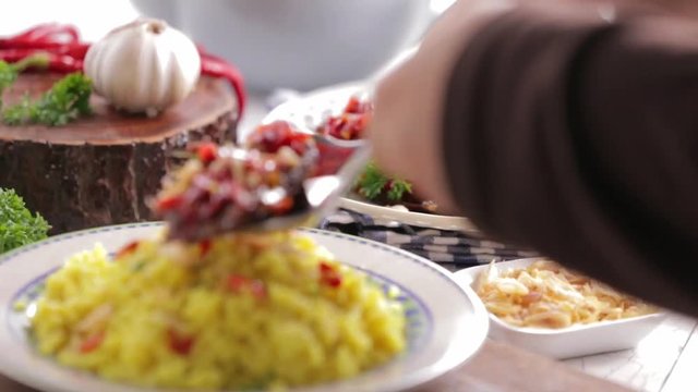 Hot and spicy beef placed on top of saffron and turmeric rice