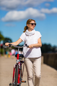 Woman and bike on pier