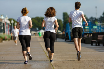 People running in city park