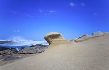 Seaside rocks worn smooth by waves over time