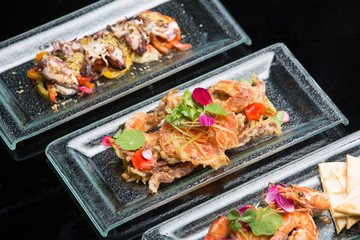 Different appetizer and anti pasti. Sea food platter Tapas and bites food concept. Shrimp, octopus, crab