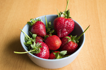 raw strawberry in the bowl on the table