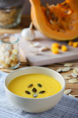 Pumpkin soup on a wooden table