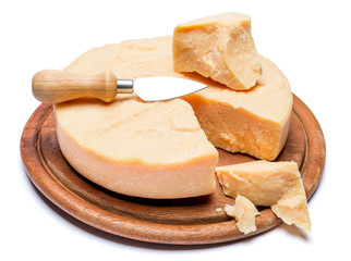 Whole round Head and pieces of parmesan or parmigiano
