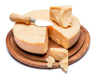 Whole round Head and pieces of parmesan or parmigiano