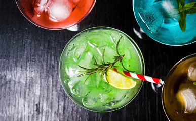 Colorful summer cocktails on black background