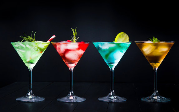 Colorful summer cocktails on black background