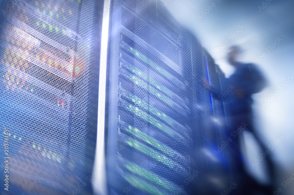 Poster shot of in large data center full of moving and working people. pronounced motion blur. computer eng