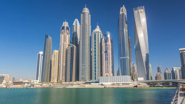 Scenic view of Dubai Marina Skyscrapers with boats timelapse, Skyline, View from sea, United Arab Emirates