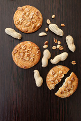 Cookies with a peanut on brown wooden table. Copy place, copy space