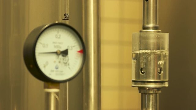 Gauges pressure control device. Manometer at craft brewery in action.