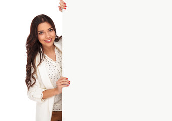 portrait of young businesswoman holding empty board from side