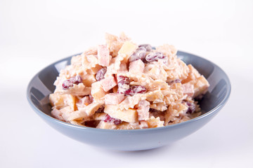 Pasta salad with cheese, ham, kidney beans and mayonnaise