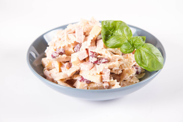 Pasta salad with cheese, ham, kidney beans and mayonnaise
