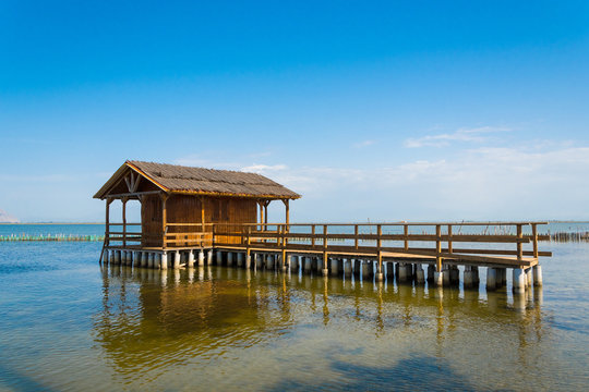 Traditional fishermen huts called peladas by the locals Tourlida area at Mesolongi sea lagoon in Greece