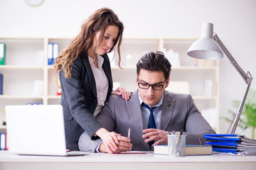 Sexual harassment concept with man and woman in office