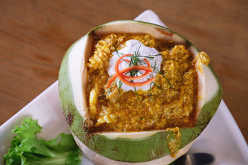 top view of Thai steamed seafood curry in coconut