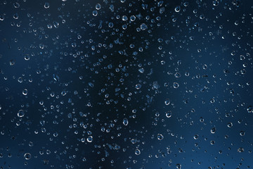water drops on a dirt glass with shallow focus