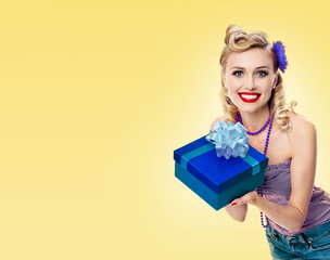 woman in pin-up style clothing with gift box