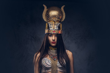 Portrait of haughty Egyptian queen in an ancient pharaoh costume.