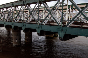 Metal steelwork bridge over a river