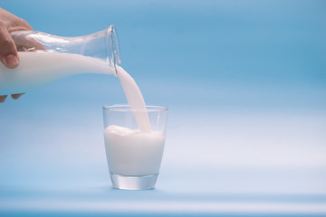 Milk on a blue background,milk,Milk bottle,Milk glass