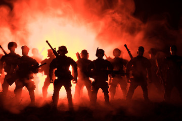 Fototapeta premium Anti-riot police give signal to be ready. Government power concept. Police in action. Smoke on a dark background with lights. Blue red flashing sirens. Dictatorship power