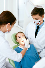 Oral Health Care. Dentist Doctors Making Examination Procedure