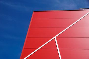 details of aluminum facade with colorful red panels