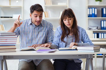 Students sitting and studying in classroom college