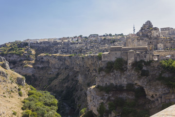 Fototapeta na wymiar Matera landscape, with its rockyravine and St.Peter caveoso church