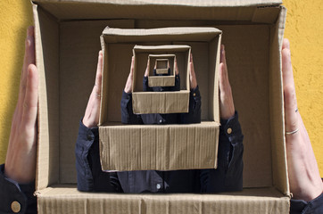 Surreal images with hands holding cardboard box