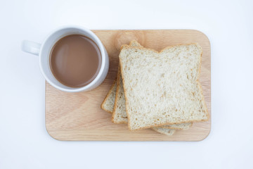Sliced Whole wheat bread and a cup of coffee on Chopping Wood on white background, Healthy concept.