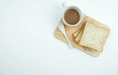 Sliced Whole wheat bread and a cup of coffee on Chopping Wood on white background, Healthy concept.