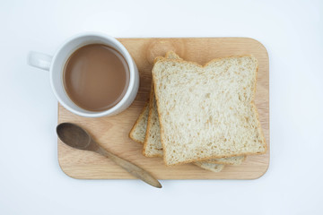 Sliced Whole wheat bread and a cup of coffee on Chopping Wood on white background, Healthy concept.