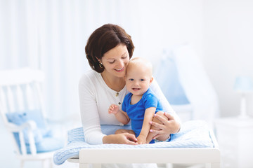 Mother and baby on changing table