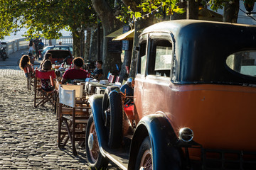 Old car parked in historic quarter in Colonia del Sacramento, Uruguay. Colonia del Sacramento is...