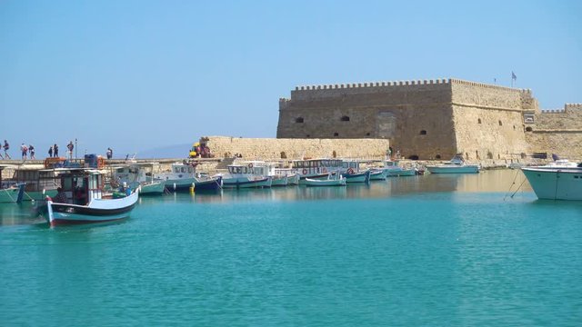 Venetian Fort in Heraklion and unmooring fishing boat, Crete Island, Greece