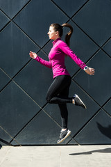 Fitness sport girl in fashion sportswear doing yoga fitness exercise in the street, outdoor sports,...