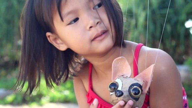 scene of girl and little chihuahua puppet
