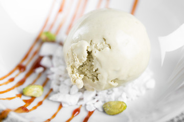 Pistachio ice cream bowl in a plate