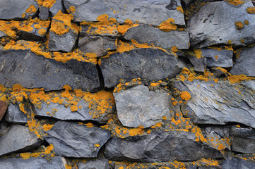 Old rough grey stone wall