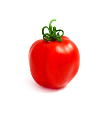 Delicious red fresh tomato with green steam, isolated on a white background.