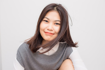 Cheerful asian young smiling to camera