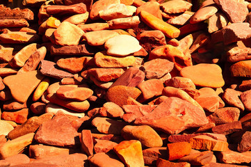 orange background of natural mountain stone, concept of natural building materials, close-up, copy space