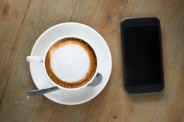 Fototapeta na wymiar Coffee with smart phone on table.