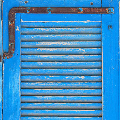 background of old grunge wooden texture with shutters. part of antique old door. For photography...